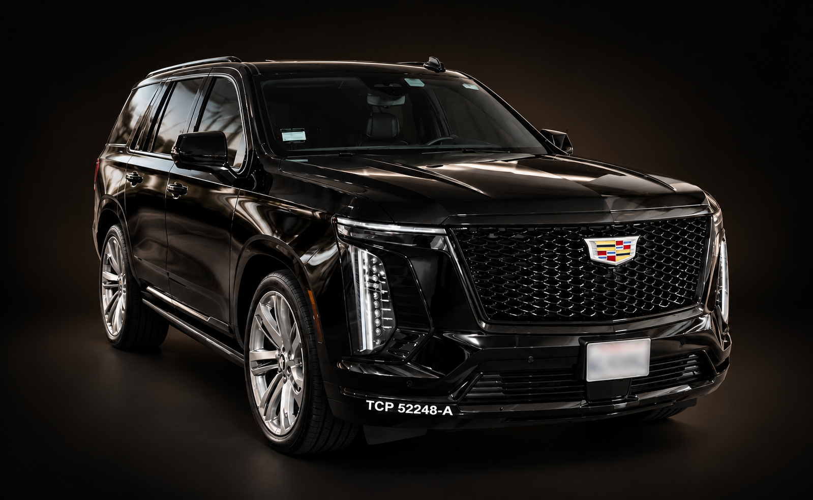 ARO Executive black Cadillac Escalade ESV at a hotel entrance