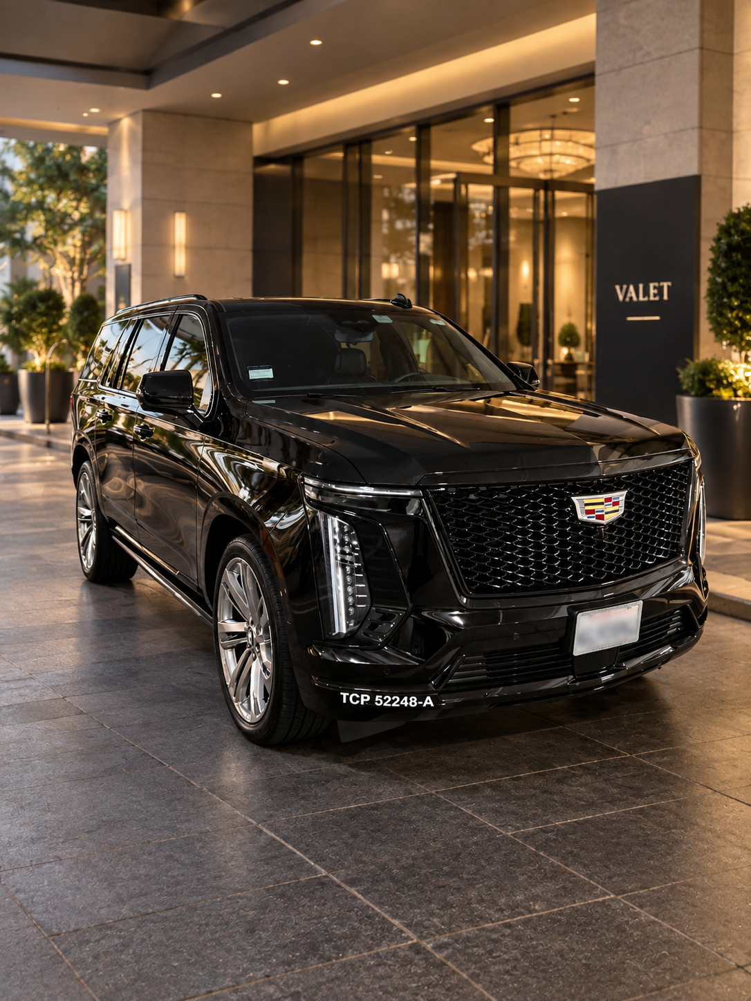 ARO Executive black 2026 Cadillac Escalade ESV at a luxury hotel valet entrance in Southern California